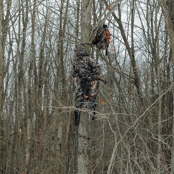 Man sitting in a treestand wearing Scentlok